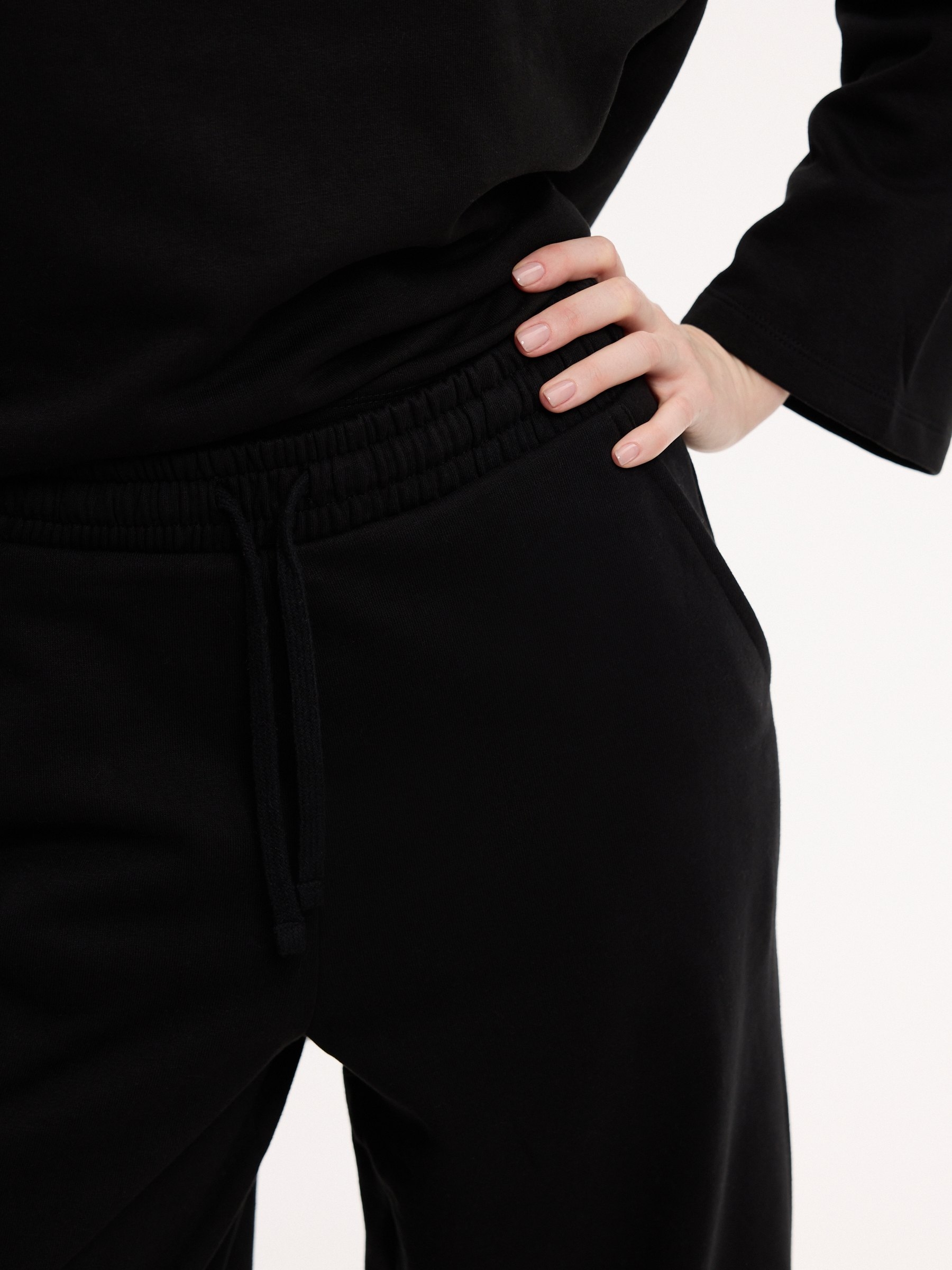 Wide-leg tracksuit bottoms black front view
