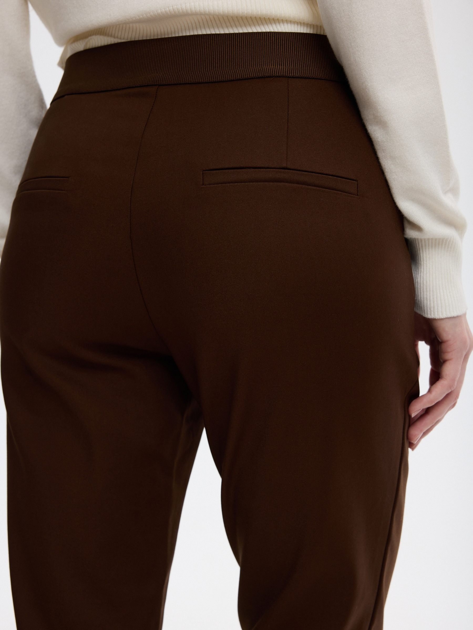 Slim pleated mid-rise pants taupe front view