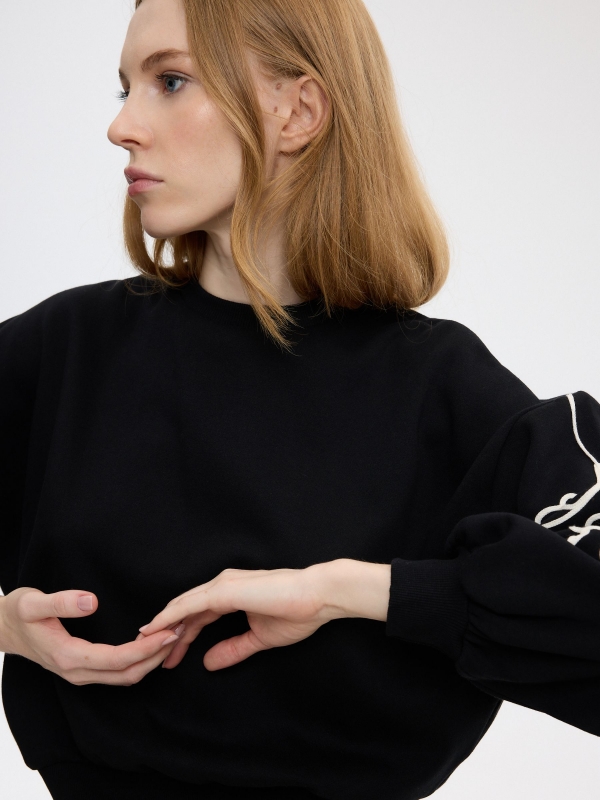 Embroidered oversized balloon-sleeve sweatshirt black detail view