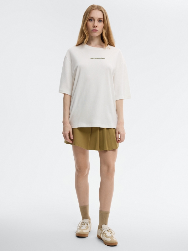 Camiseta oversize algodón texto blanco roto vista general frontal