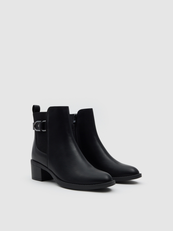 Chelsea ankle boot medium heel buckle black 45º front view