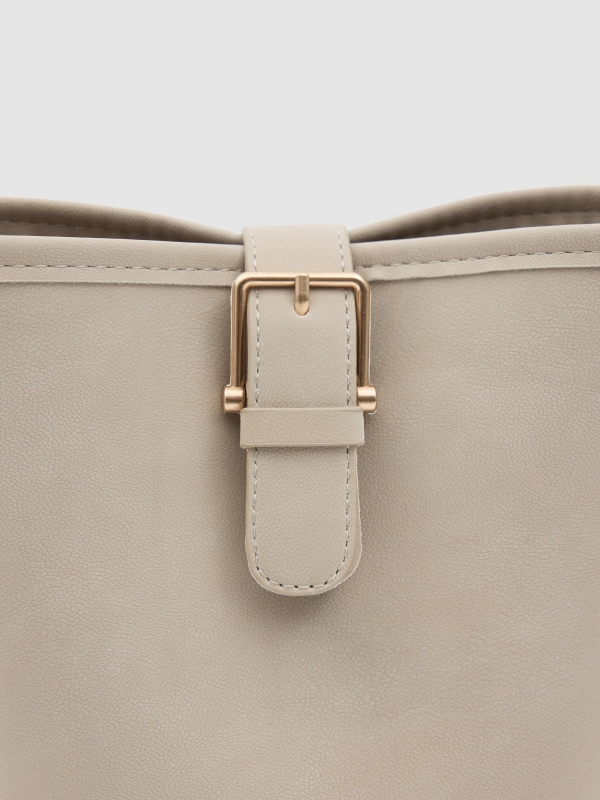 Shoulder bag with gold buckle beige inside view
