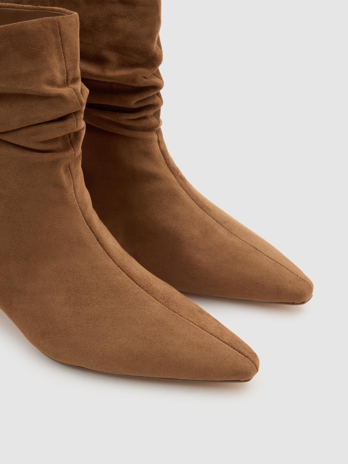 Low heel bootie with leather effect camel detail view