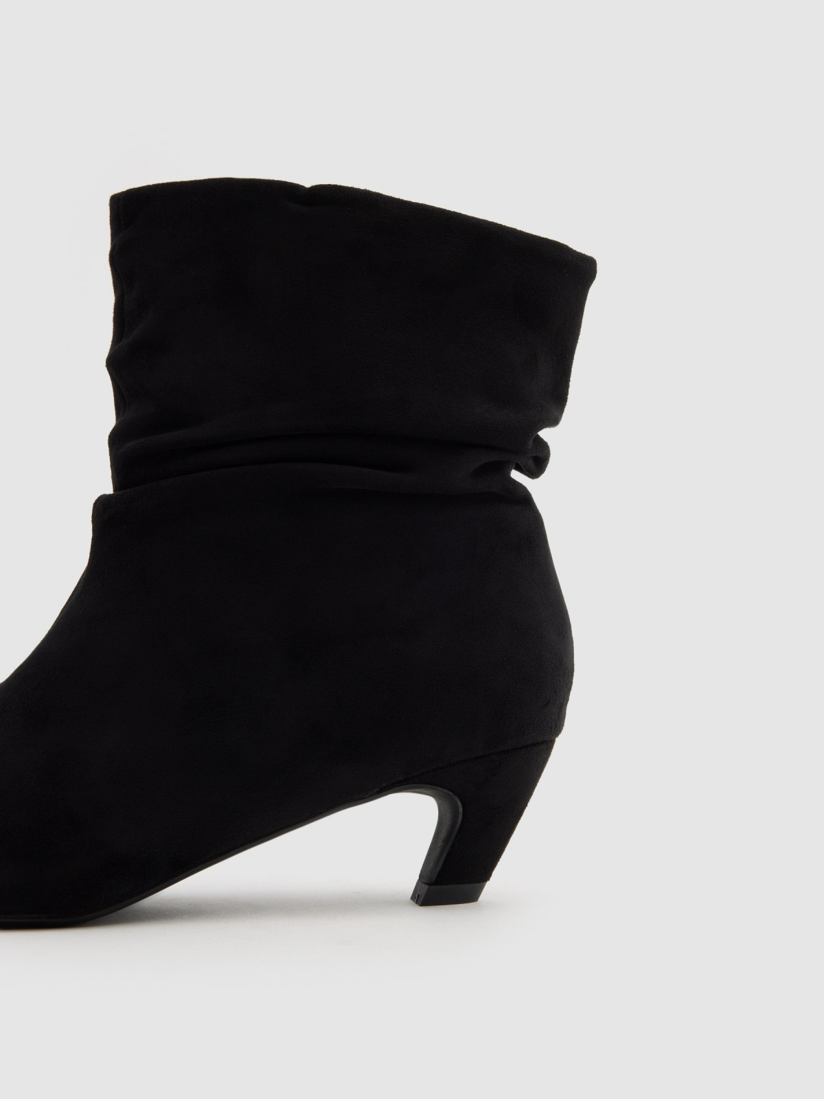Bootie with mid heel leather effect black detail view