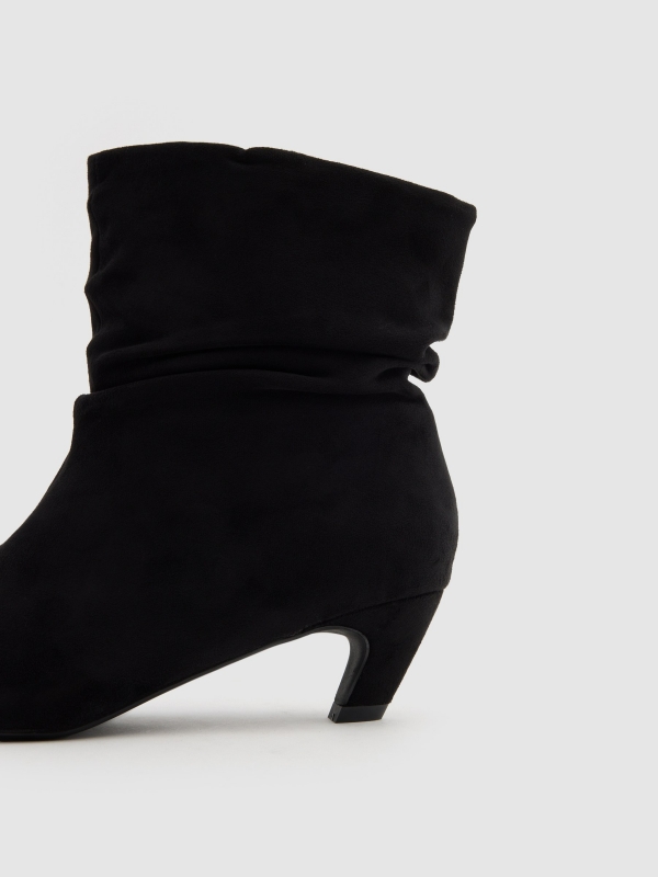 Bootie with mid heel leather effect black detail view