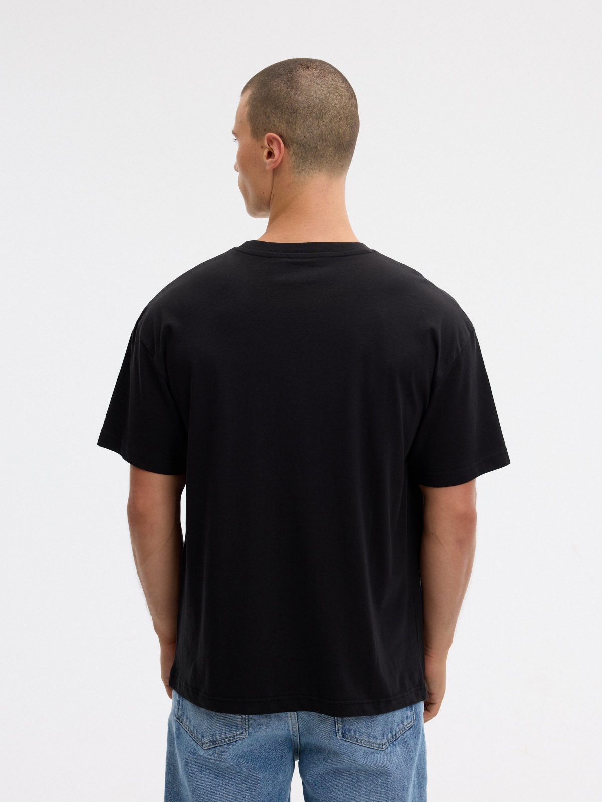 T-shirt oversize hooligans preto vista meia traseira