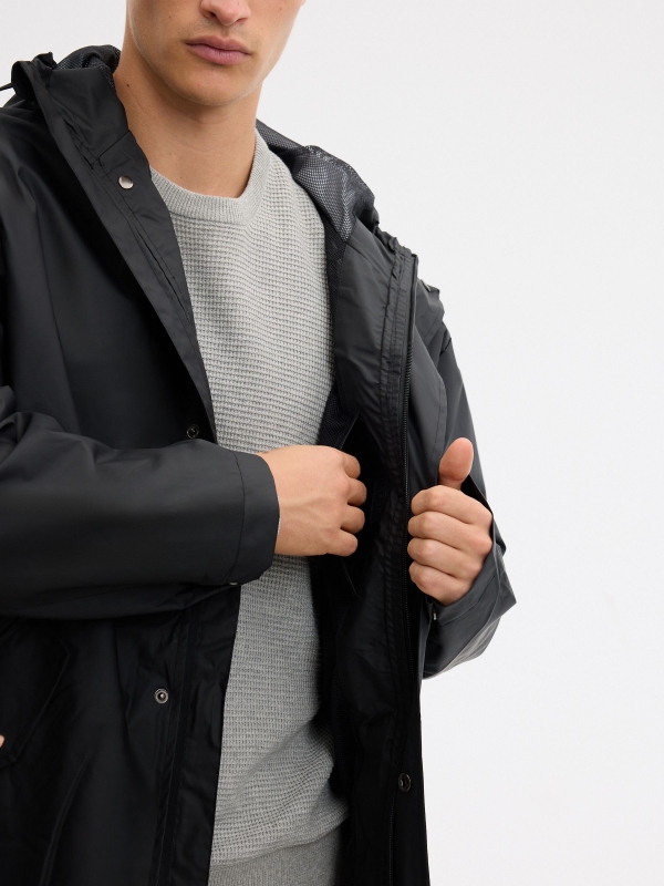 Rubberized fabric parka black detail view