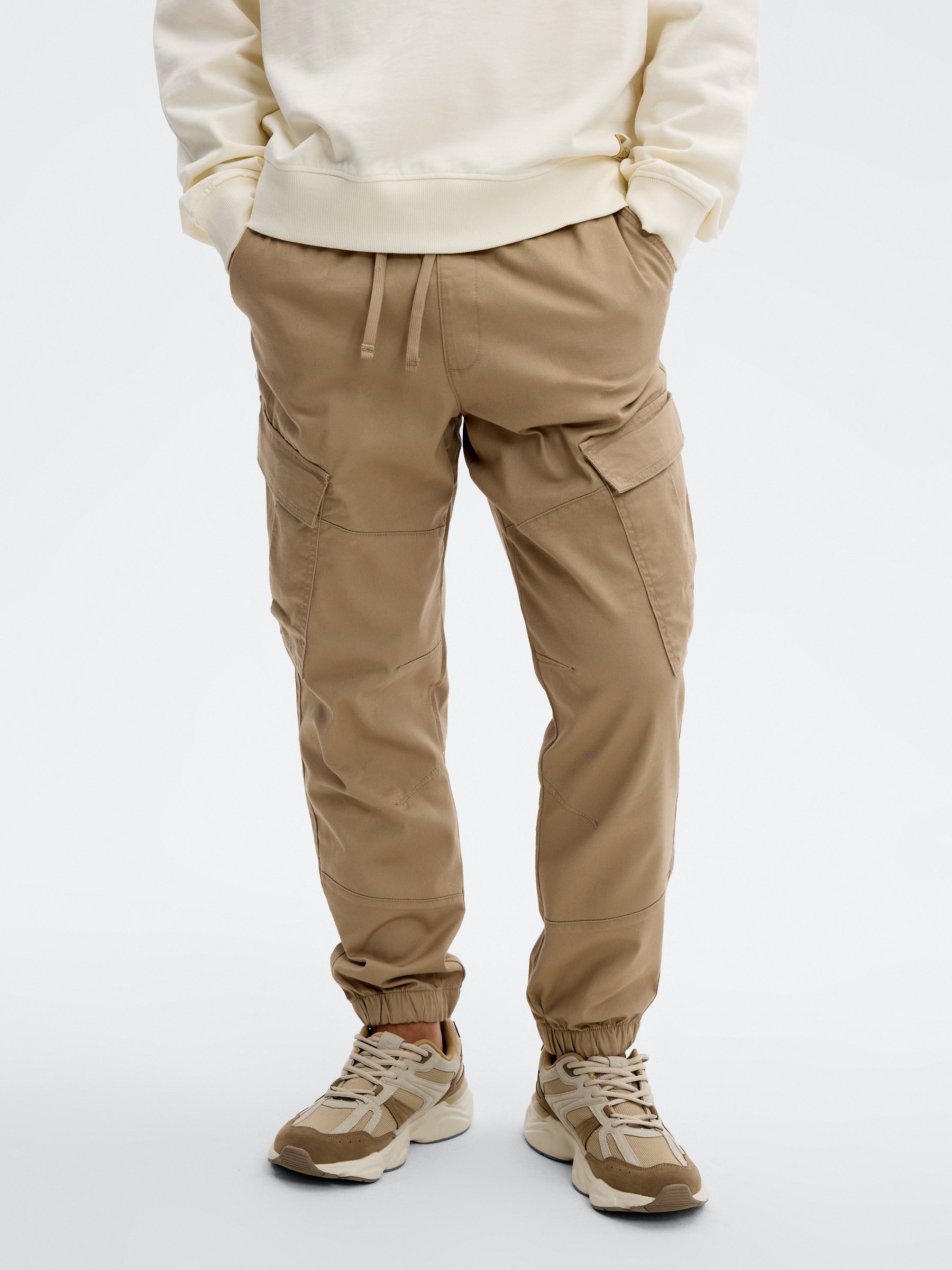 High-rise cargo jogger pants beige front view