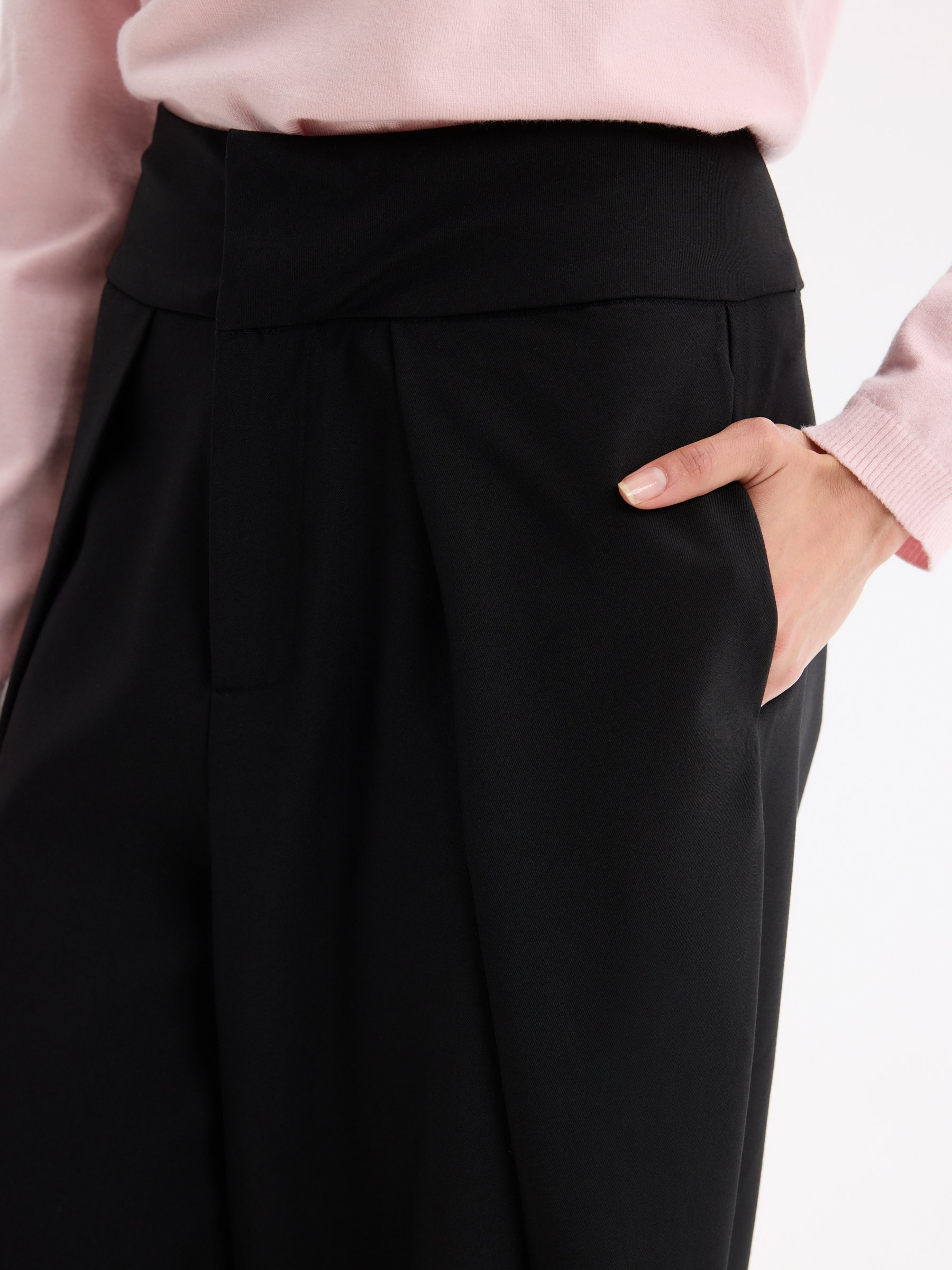 High-waisted pleated balloon pants black front view