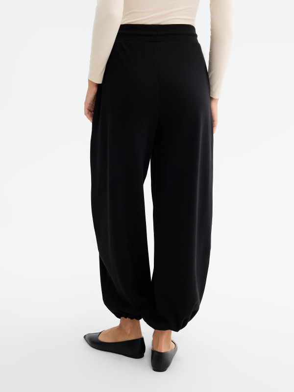 Barrel stoppers fleece pants black middle back view