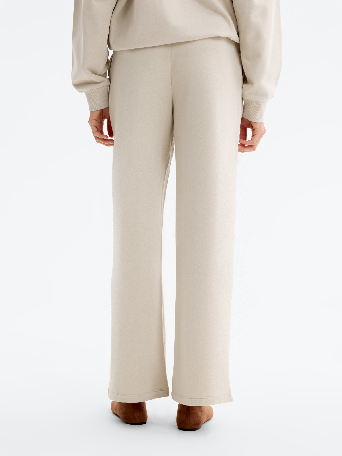 Wide-leg tracksuit bottoms raw middle back view