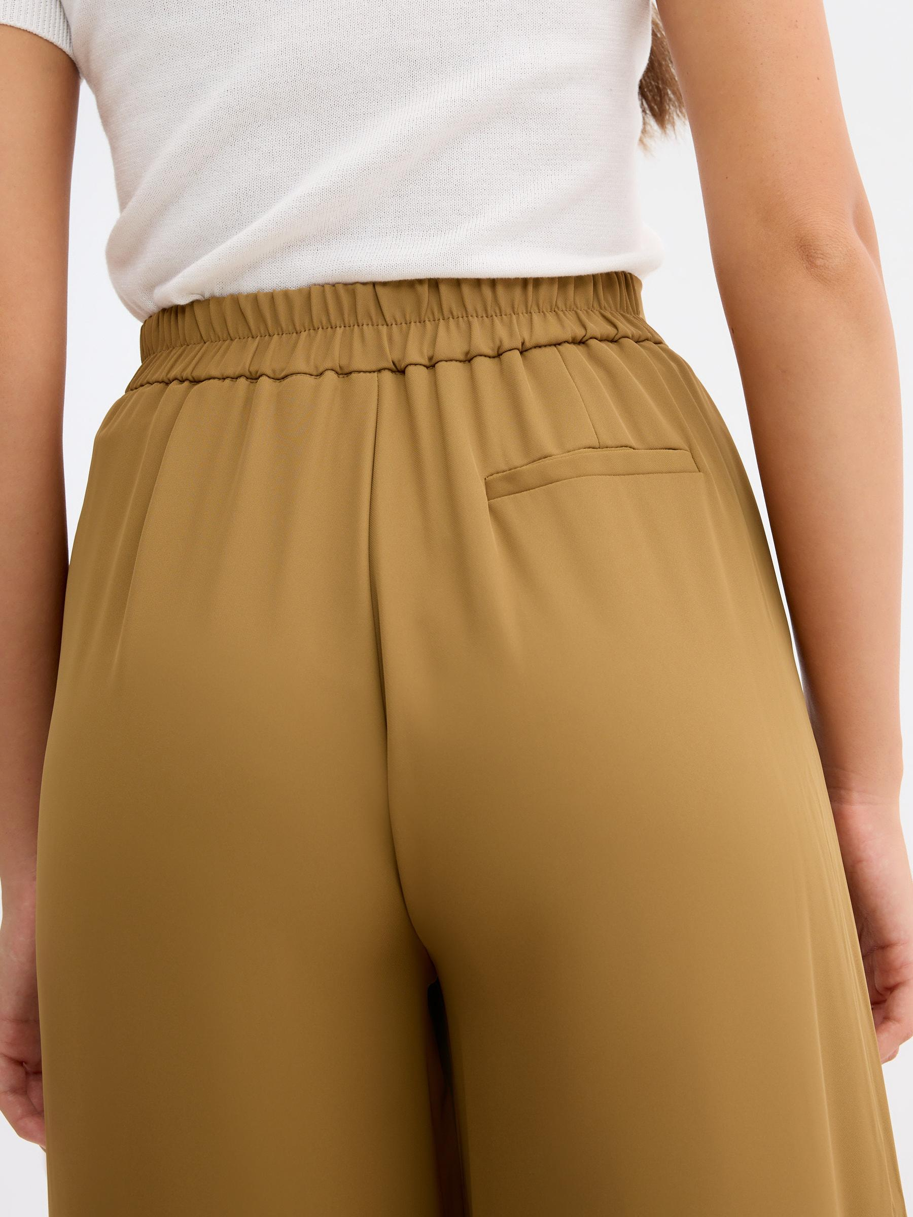 High-waisted palazzo pants brown front view