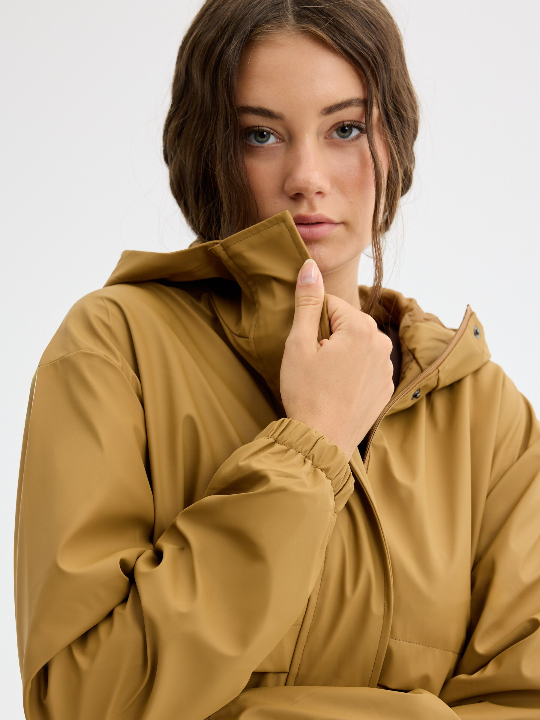 Rubberized parka with hood cinnamon middle front view
