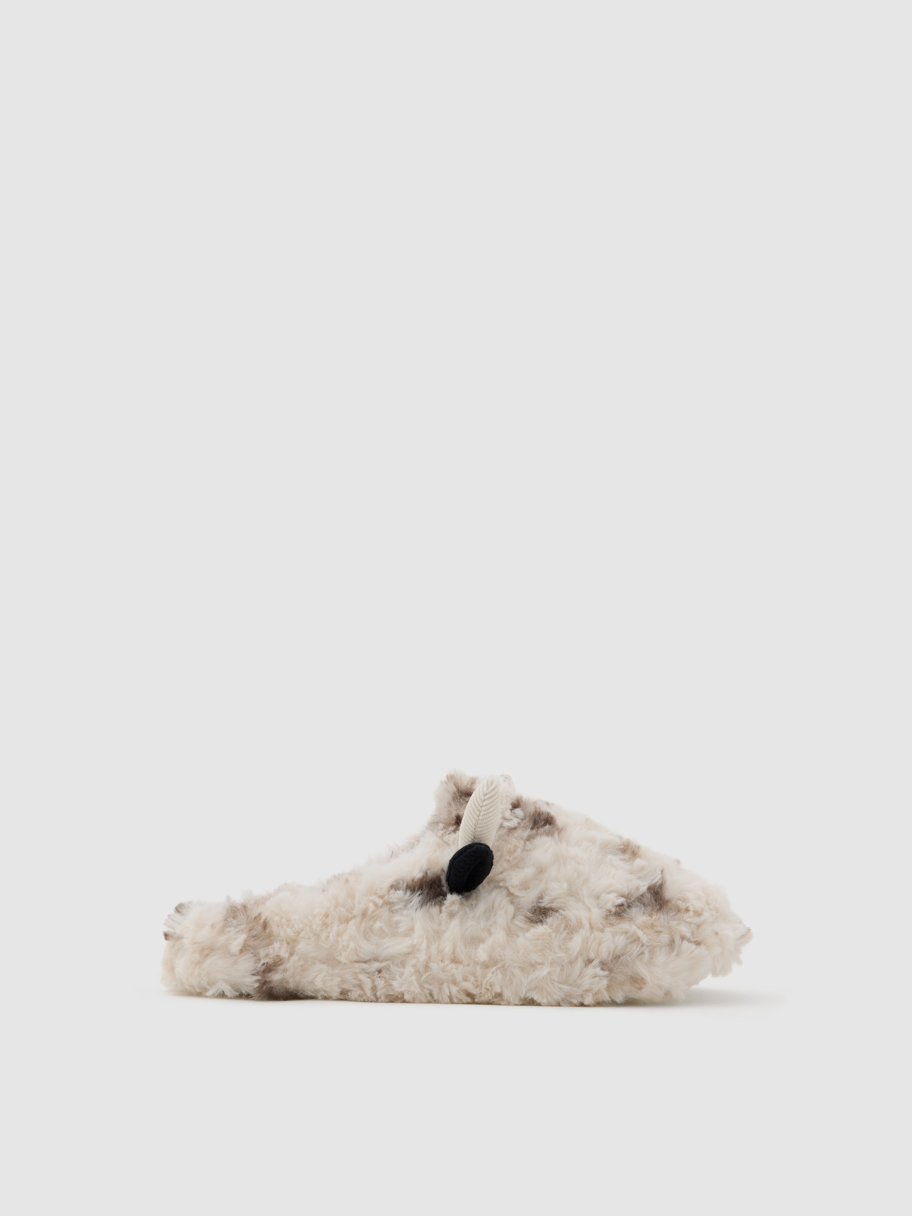 Cow-print furry sneakers off white front view