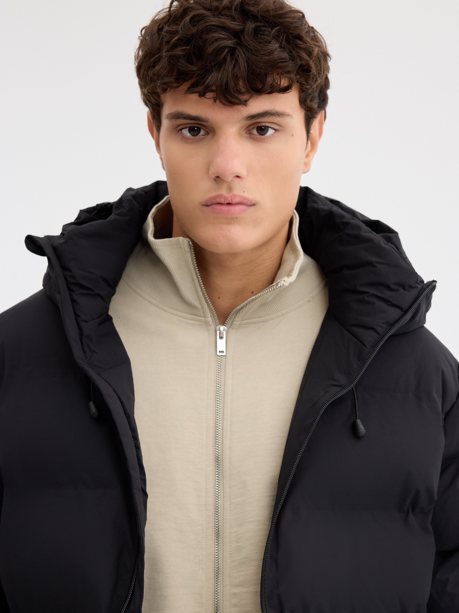 Quilted nylon hooded jacket black middle front view