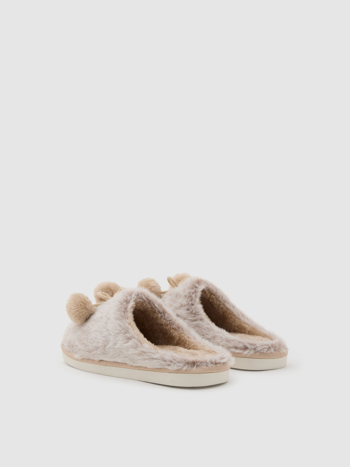 Zapatillas destalonadas con pompones beige vista media trasera