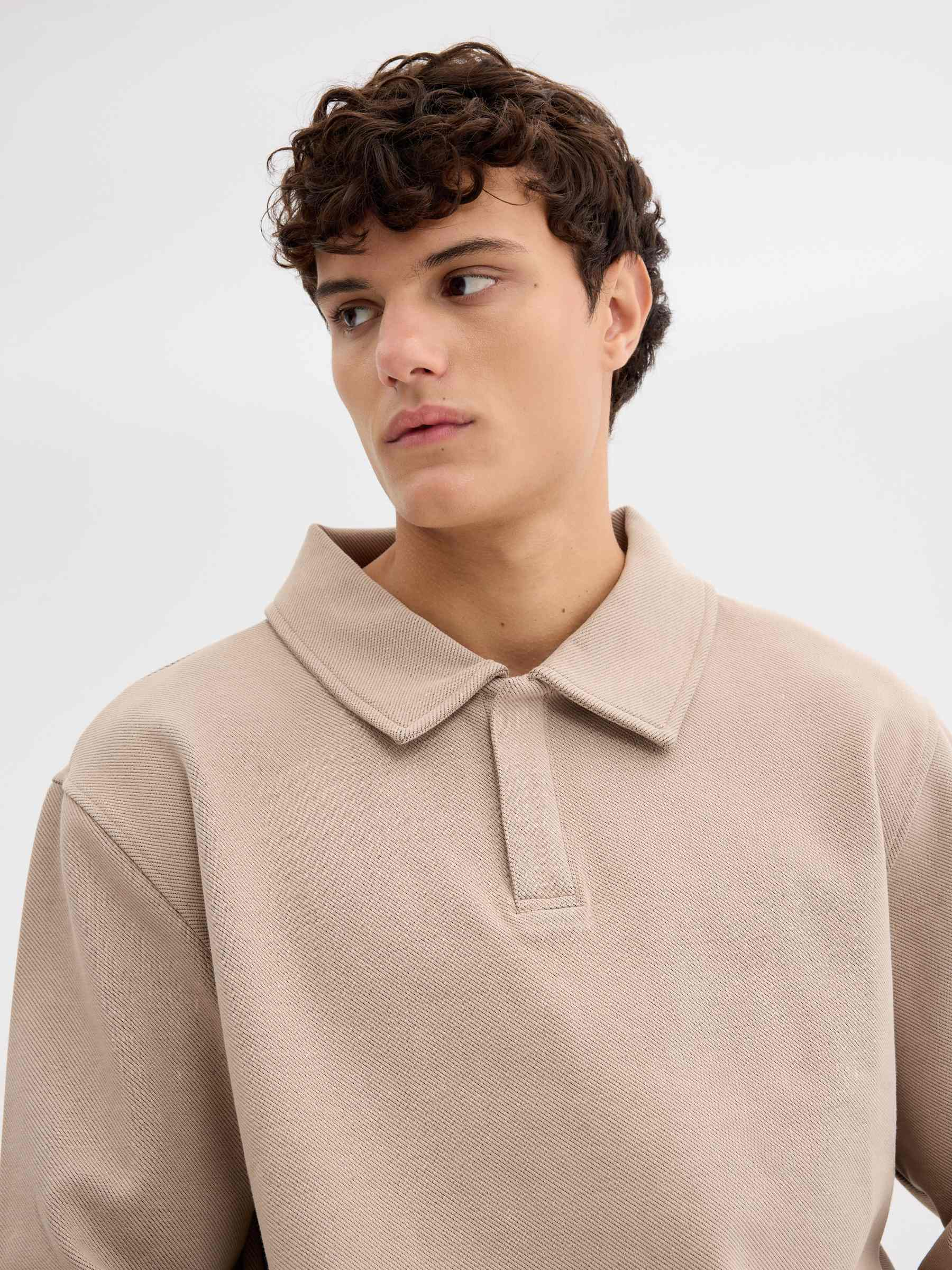 Oversized polo sweatshirt with buttons beige middle front view