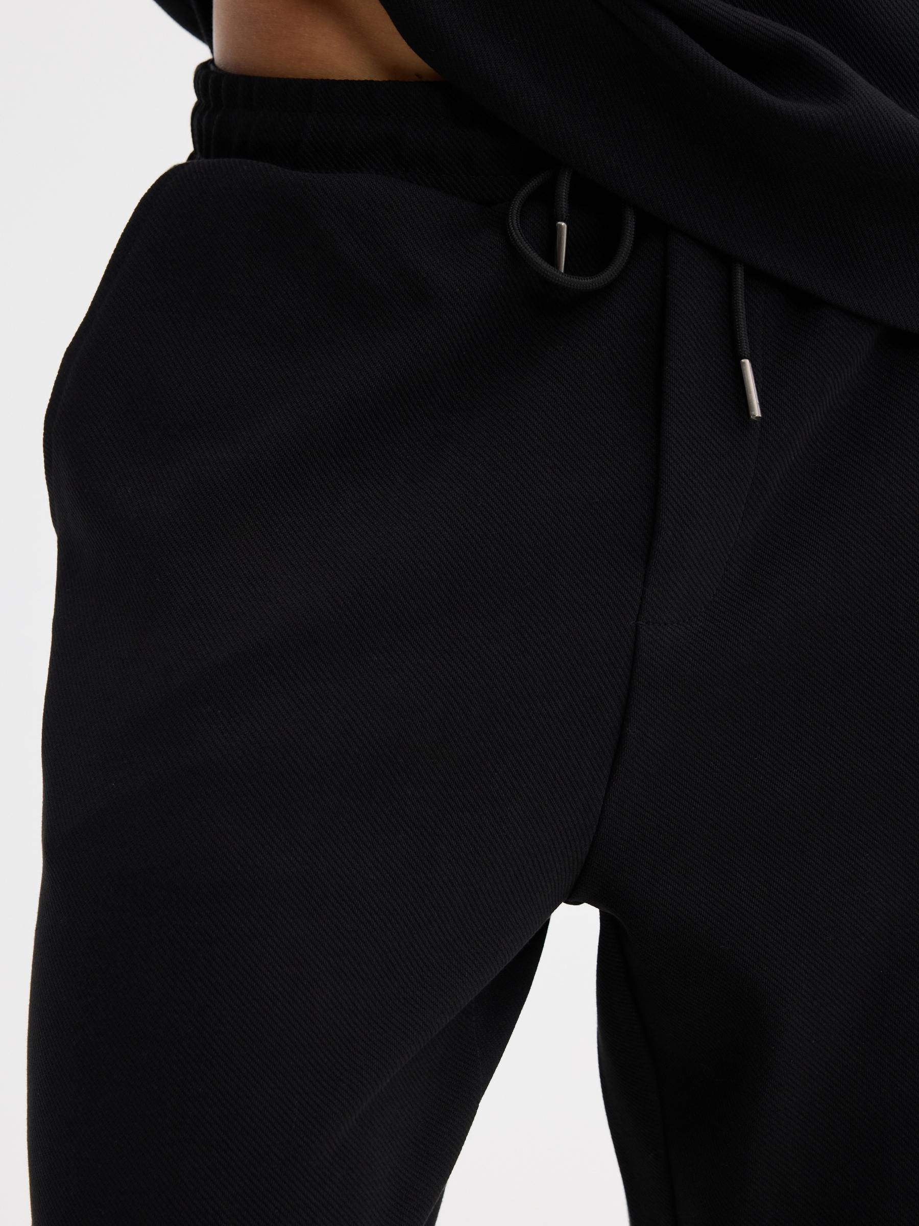  High-rise cotton jogger pants black front view