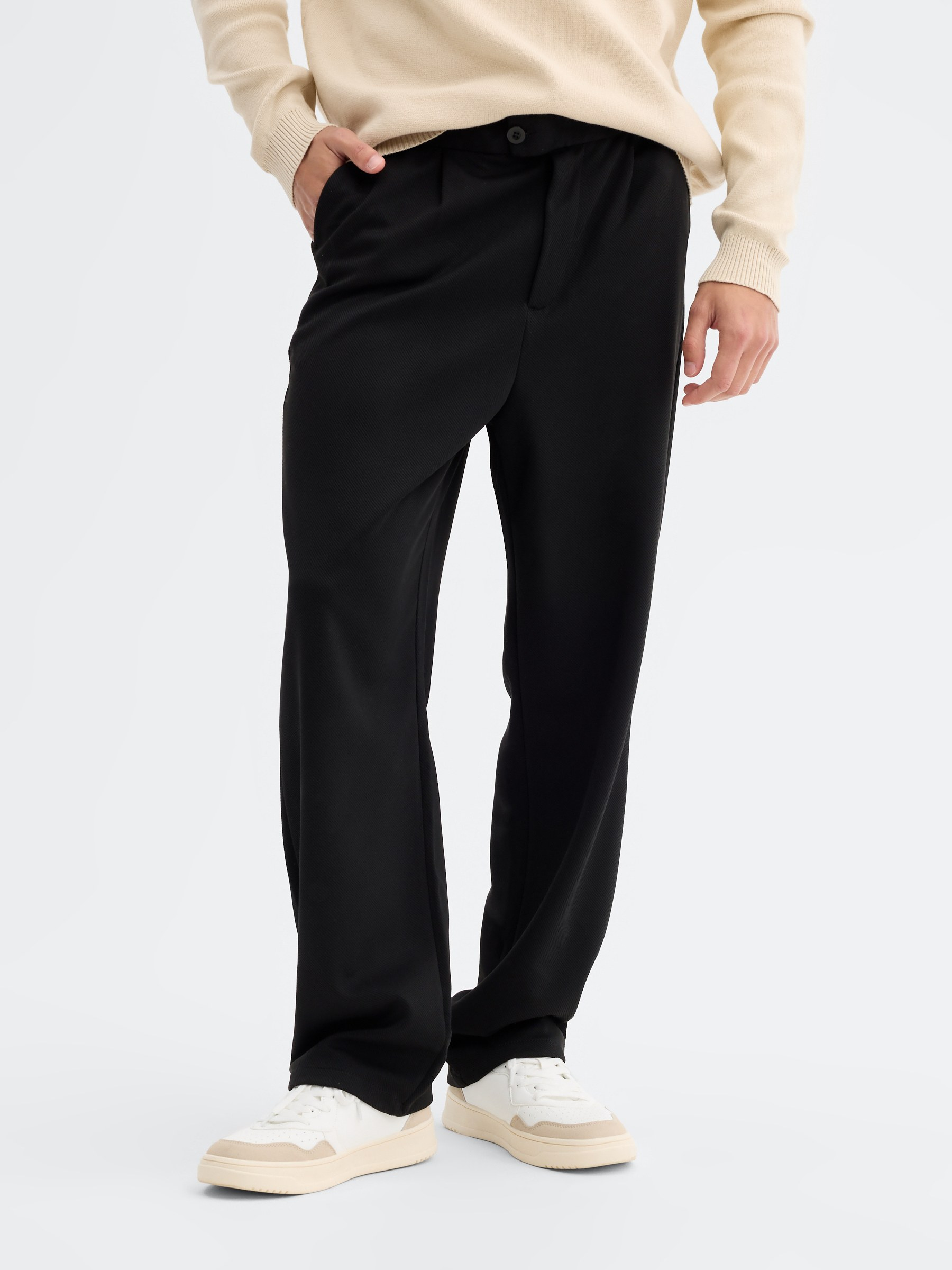 High-waisted polyester chino pants black front view