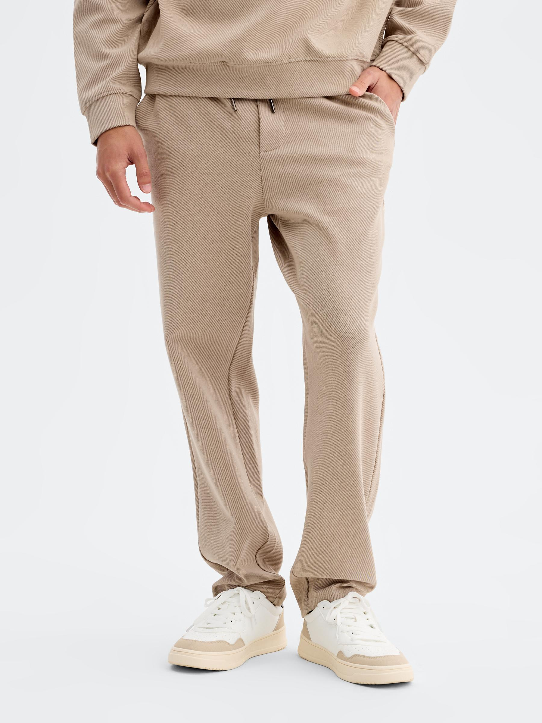 High-rise cotton jogger pants beige front view
