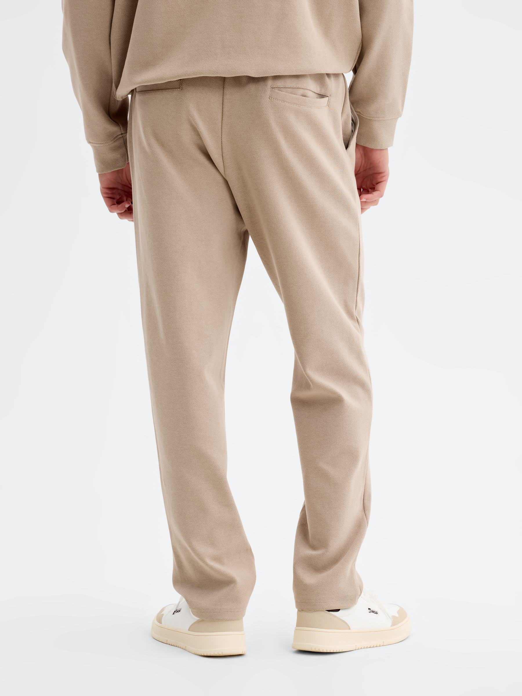 High-rise cotton jogger pants beige front view