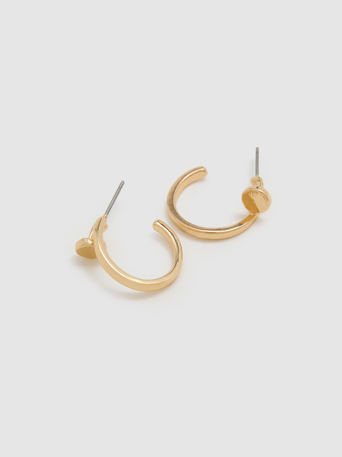 Set of gold earrings golden detail view